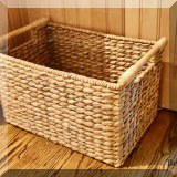 D081. Storage basket with wooden handles.